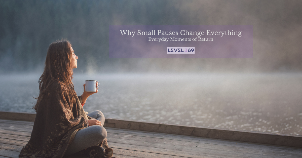Woman sitting by a lake holding a mug during a quiet morning pause