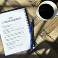 Open gratitude journal pages with prompts on wooden table beside coffee and pen Level 369