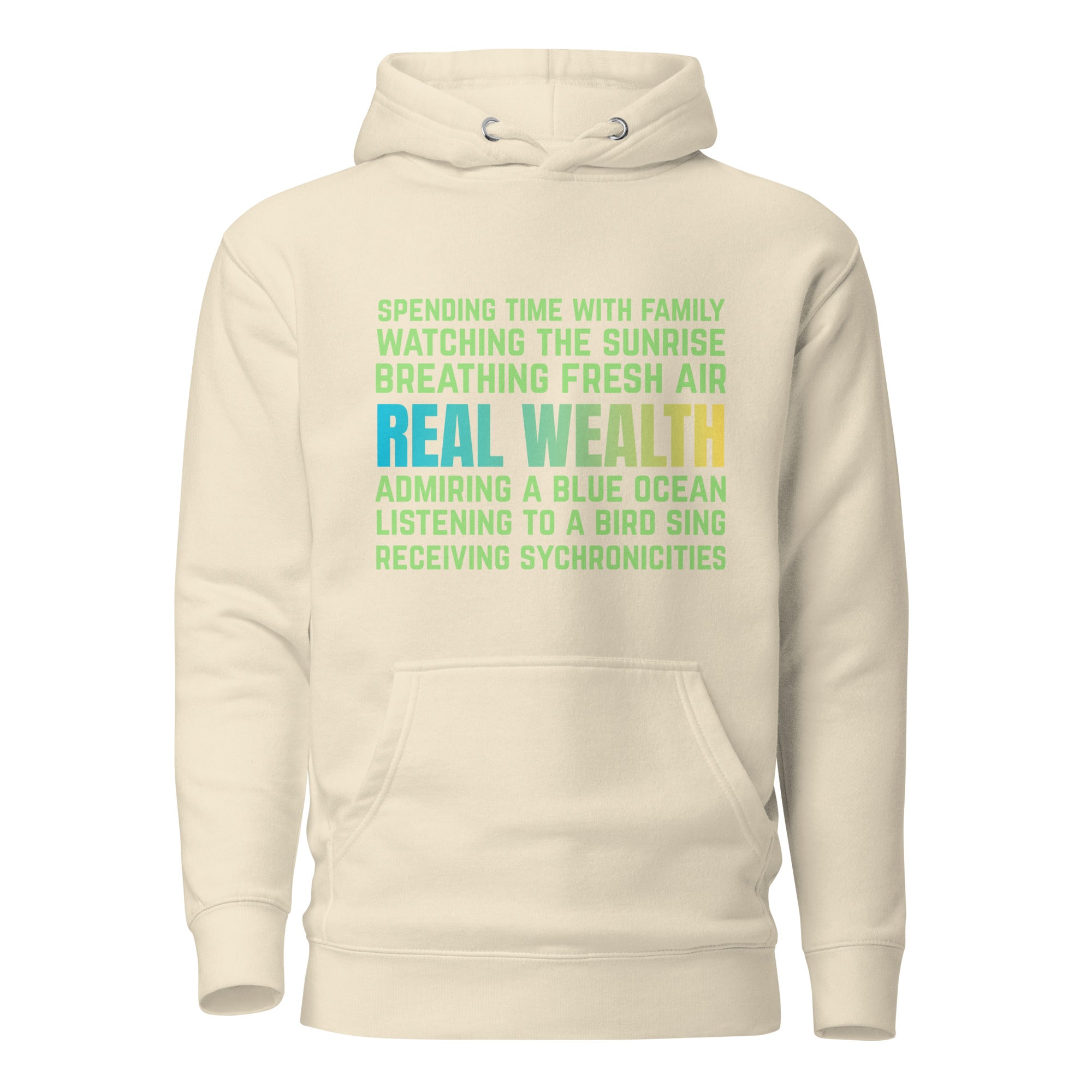 Off-white unisex hoodie featuring the “Real Wealth” affirmation design with layered text about nature, breath, and synchronicity.