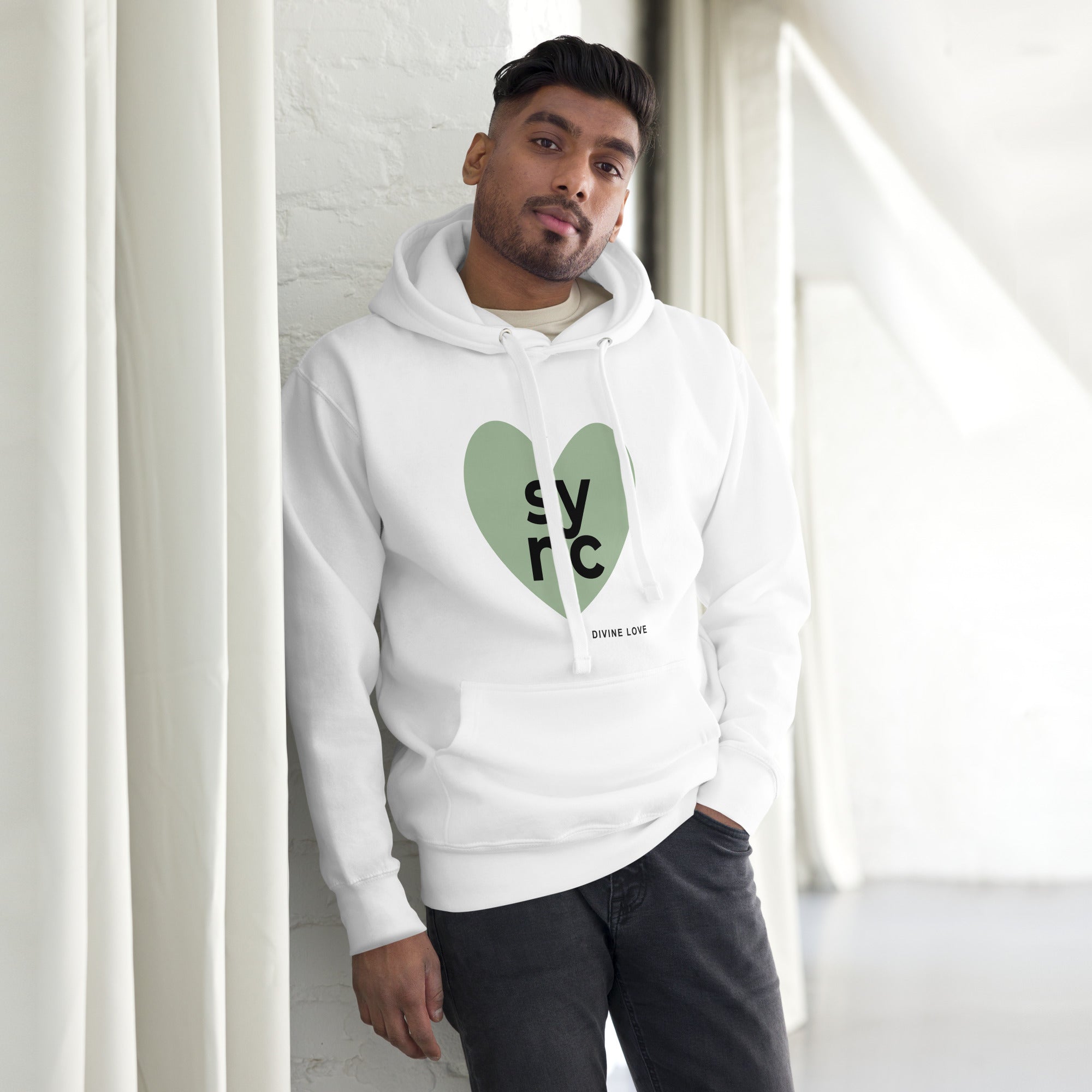 Unisex hoodie featuring a sage-green heart logo with SYNC lettering and Divine Love text.