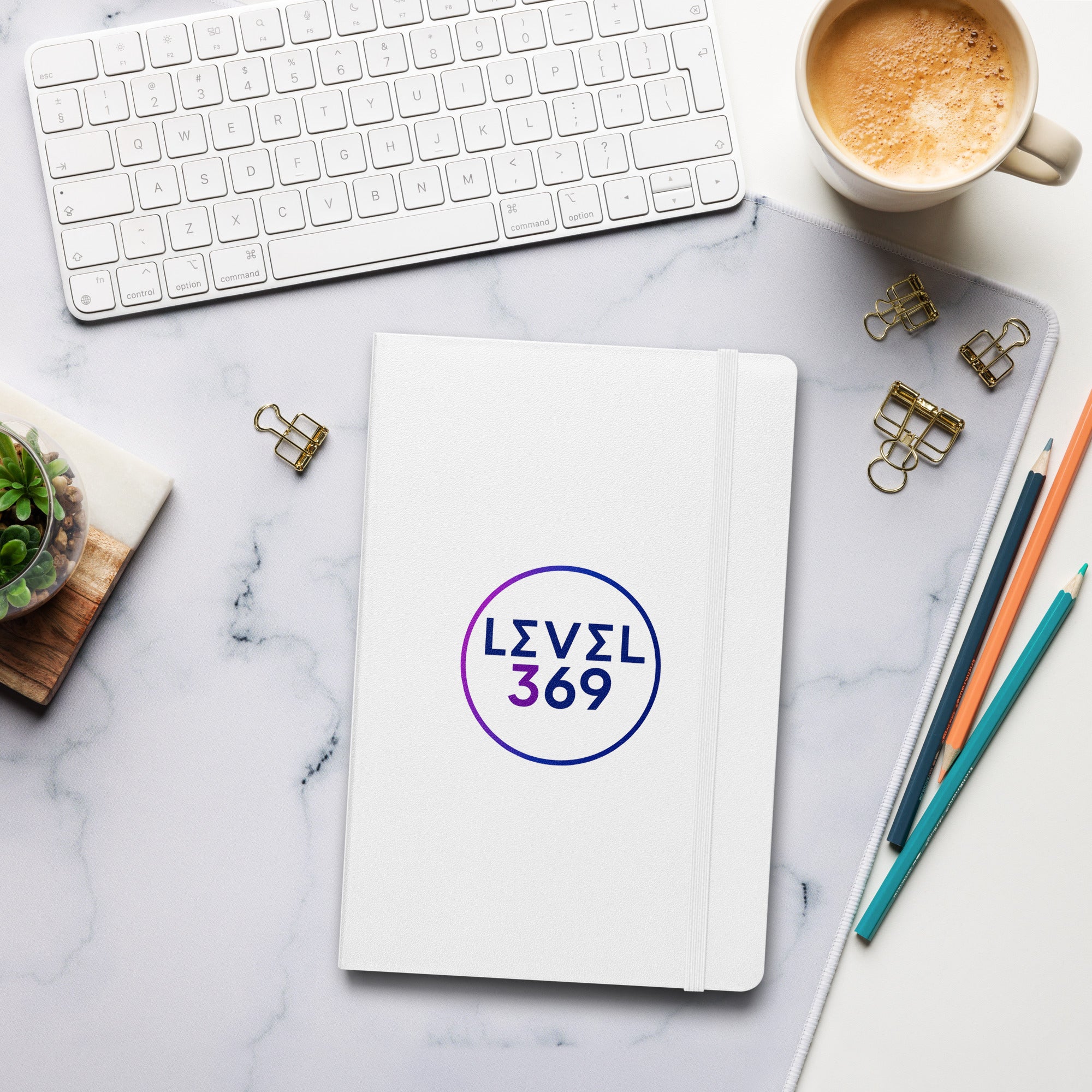 White journal featuring the “Level 369” logo on the front cover.