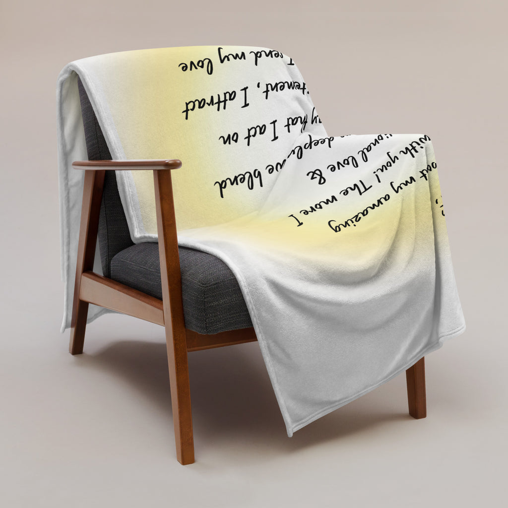 Affirmation blanket featuring handwritten-style text addressed to the higher self, draped over a modern armchair with a soft pastel gradient background.