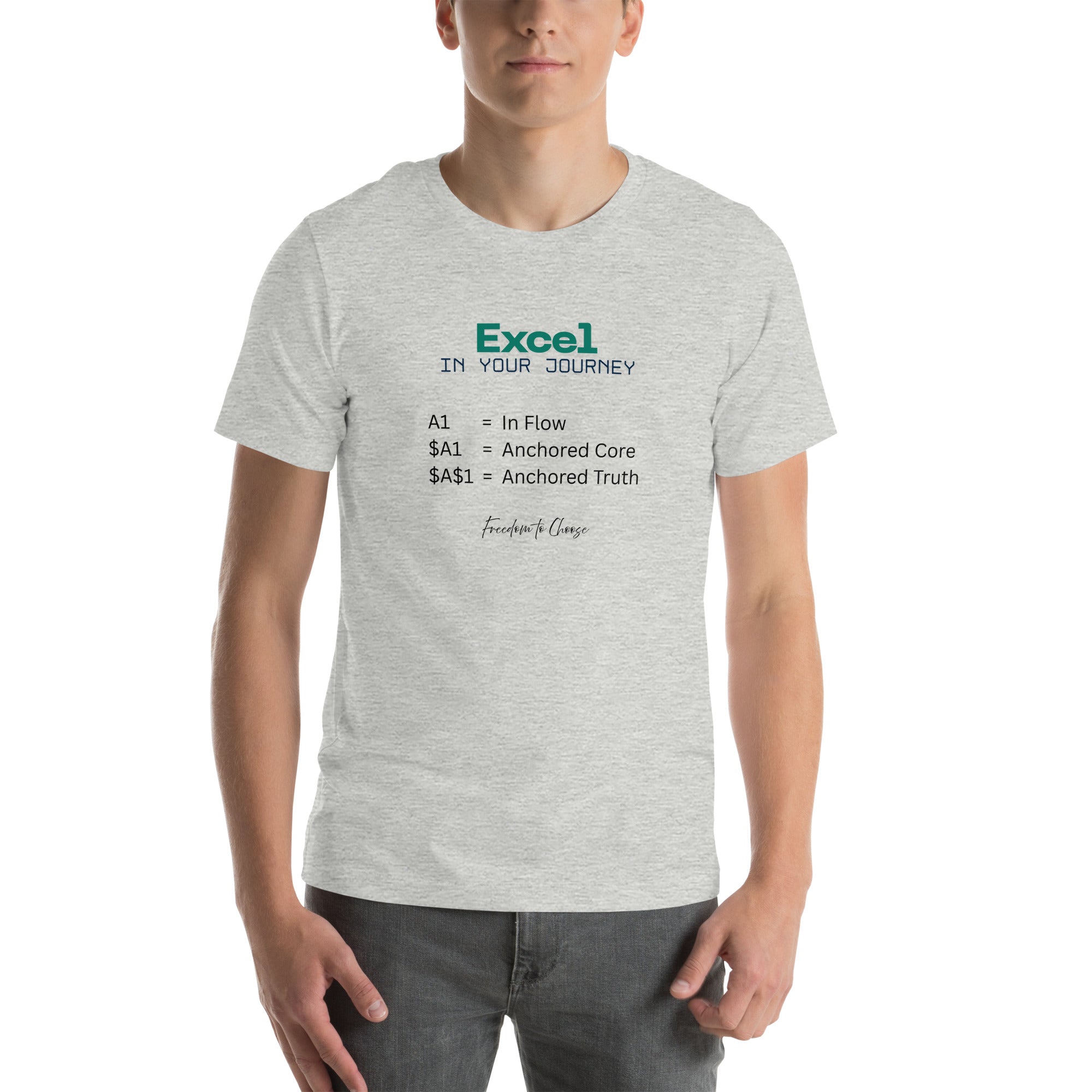 Heather grey unisex white t-shirt featuring the word “Excel,” the phrase “In Your Journey,” and text explaining A1, $A1, and $A$1 as metaphors for flow, anchored core, and anchored truth.