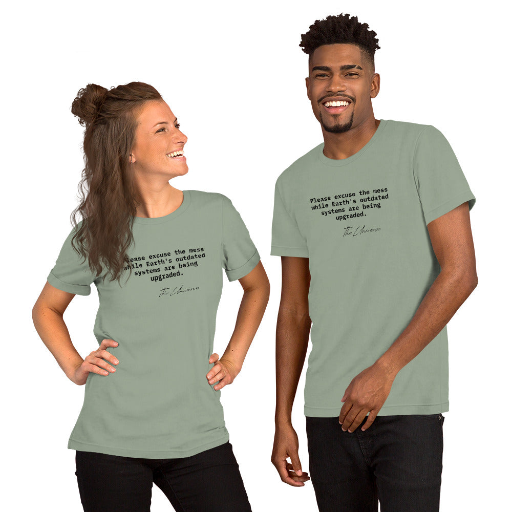 Sage unisex t-shirt featuring the phrase 'Please excuse the mess while Earth’s outdated systems are being upgraded.'