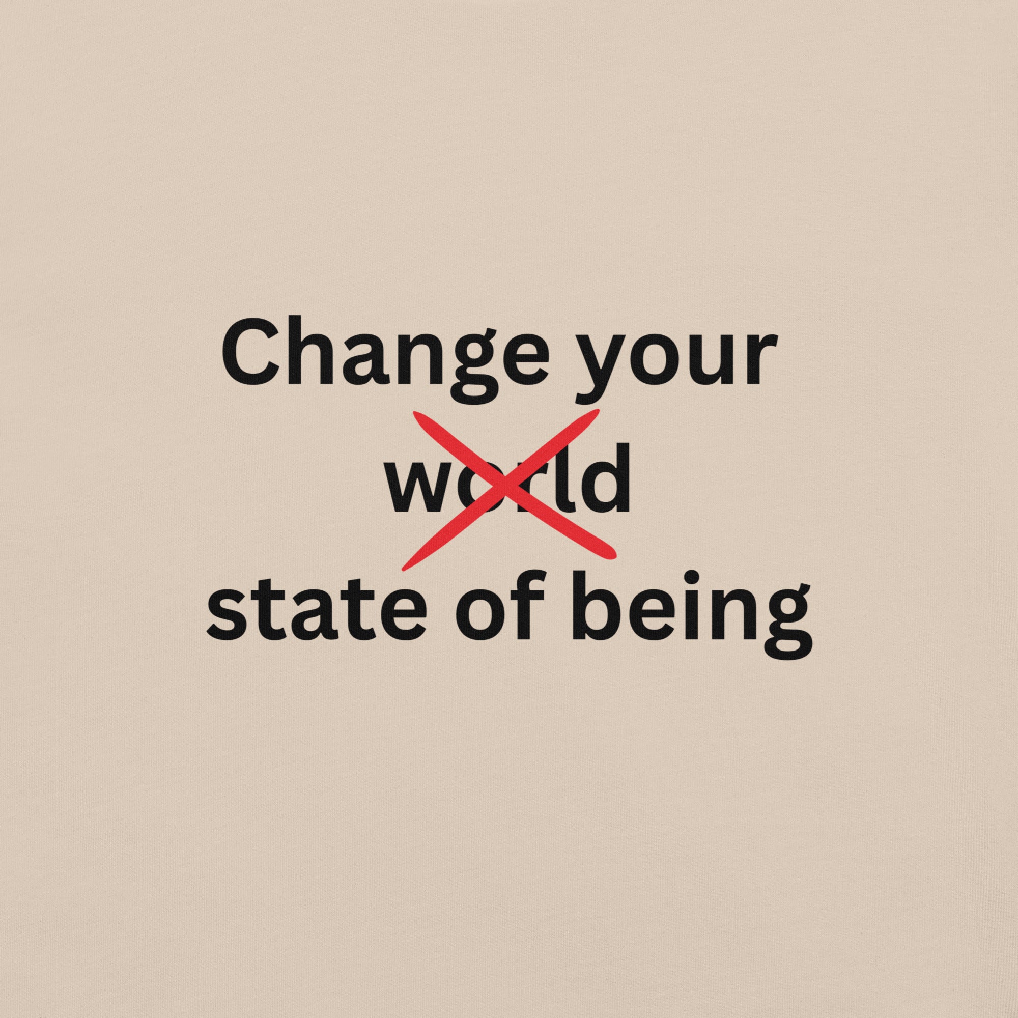 Close-up of a cream minimalist t-shirt featuring the phrase “Change your state of being” with the word “world” crossed out in red typography.