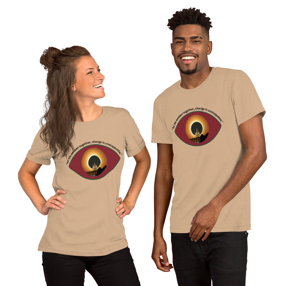 Tan unisex t-shirt featuring the phrase “As We Awaken Together."