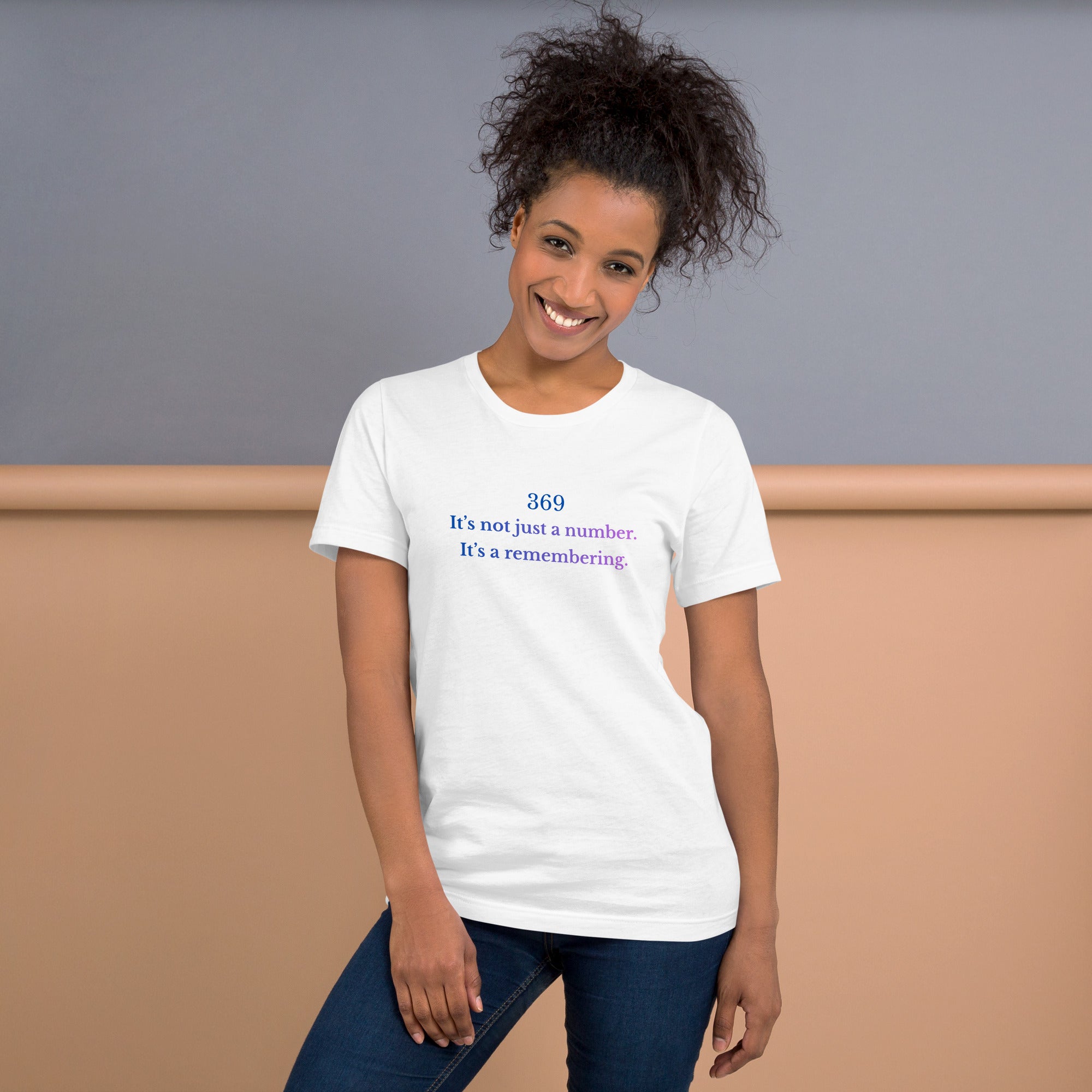 Unisex t-shirt featuring the phrase ‘369 – It’s not just a number. It’s a remembering,’ in a soft blue-to-violet gradient.