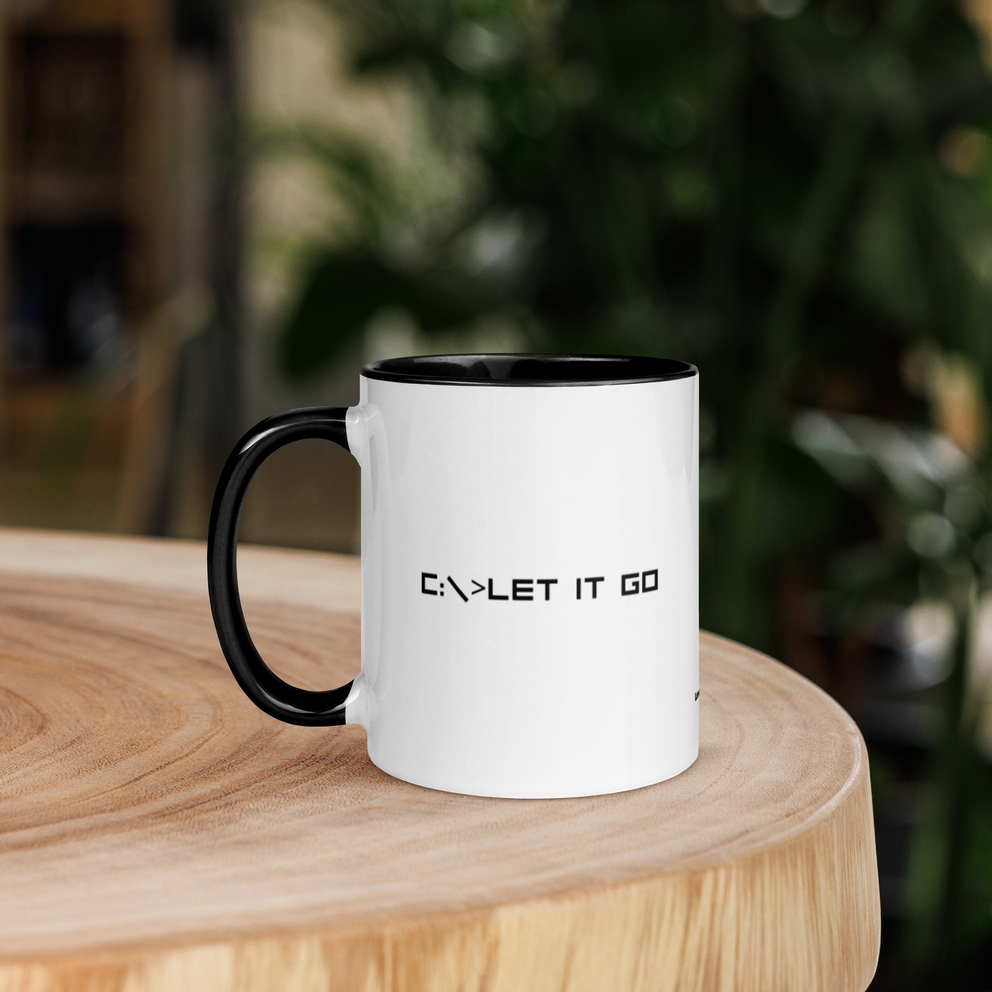 White mug with minimalist “let it go” text design, clean modern style for mindfulness and emotional release