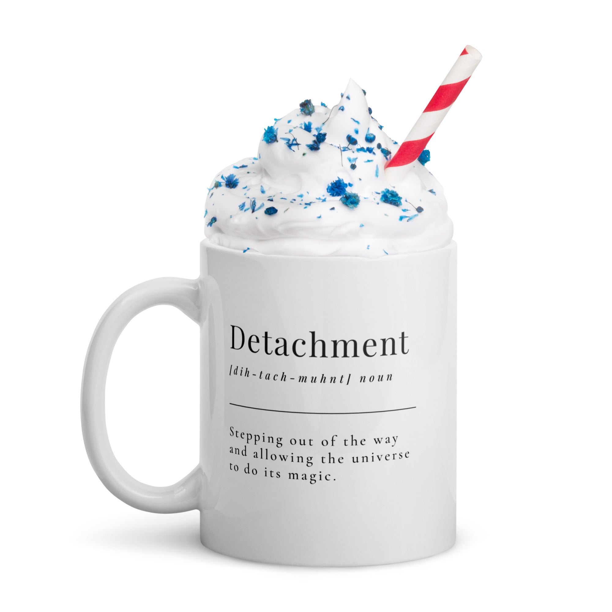 White ceramic mug featuring the word "Detachment."

